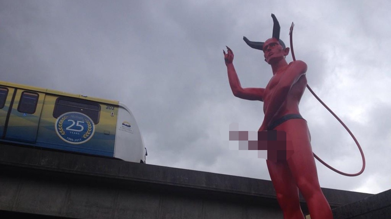 A racy statue of the devil sprang up near the Clark Drive SkyTrain station overnight, and nobody seems to know how or why it got there. Sept. 9, 2014. (CTV) 