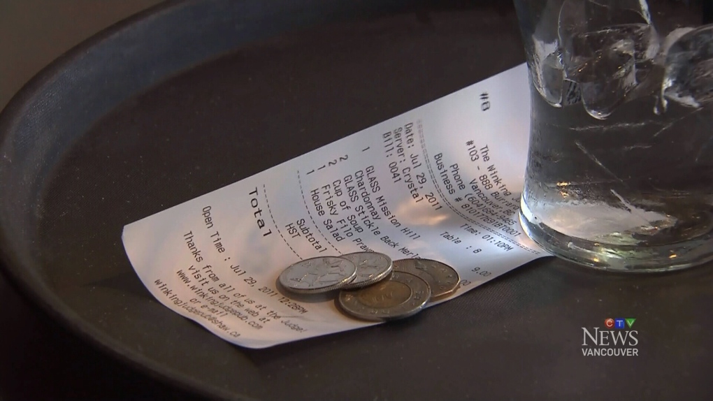 A restaurant bill and some coins are pictured in an undated file photo by CTV Vancouver. A new Angus Reid Institute poll shows nearly three-quarters of British Columbians have reached a tipping point when it comes to gratuity. 