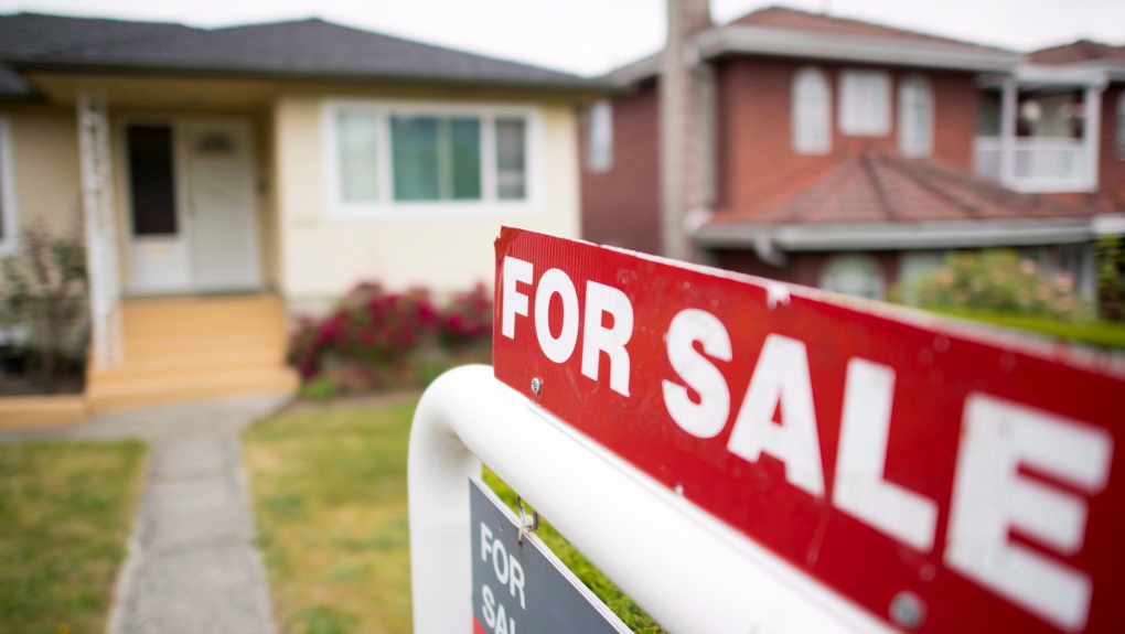 A real estate sign is pictured in Vancouver on June, 12, 2018. (THE CANADIAN PRESS/Jonathan Hayward)