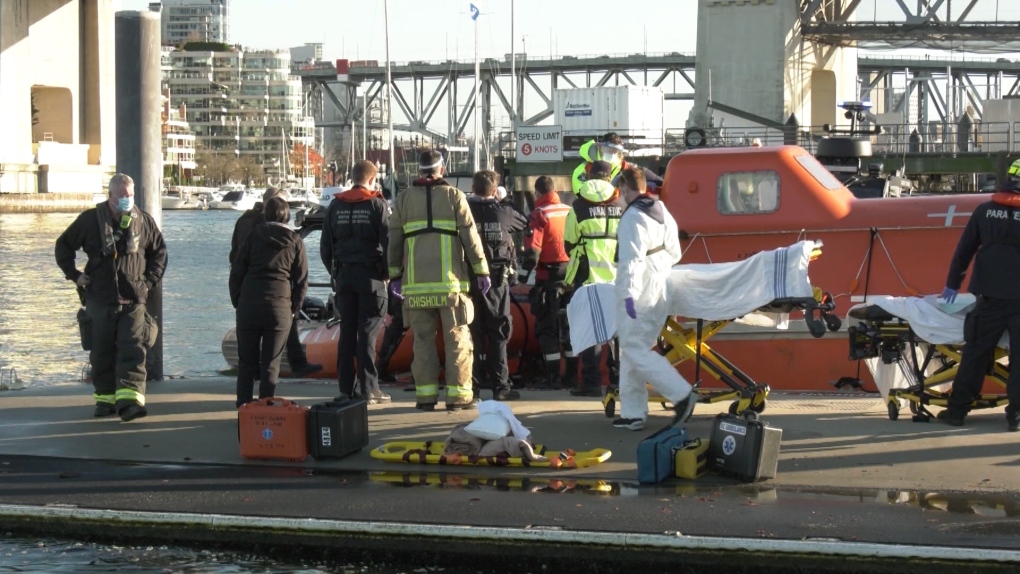 First responders attend a scene in Vancouver after two crew members were hurt as they carried out a routine drill in a covered lifeboat on Dec. 1, 2020.