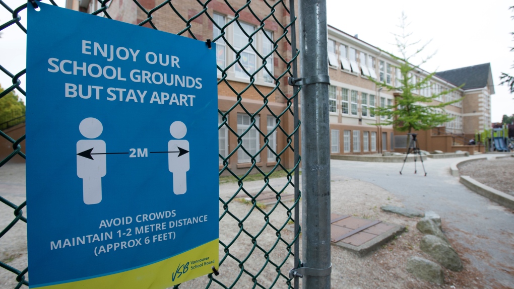 A physical distancing sign is seen during a media tour of Hastings Elementary School in Vancouver on Sept. 2, 2020. (Jonathan Hayward / THE CANADIAN PRESS)