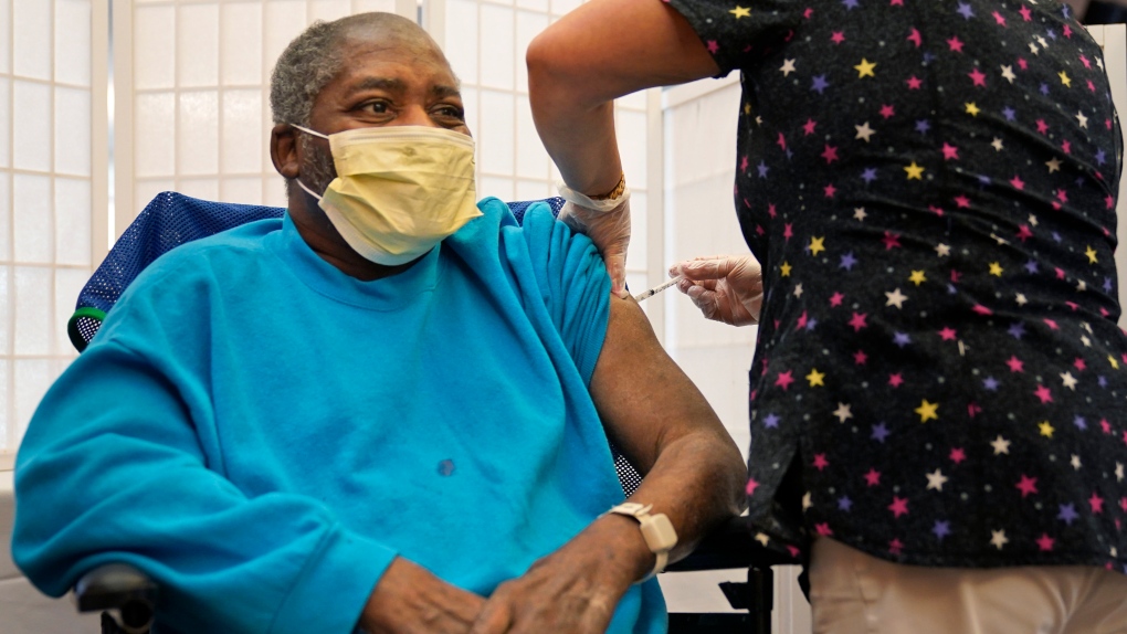 In this Sept. 27, 2021, file photo, Edward Williams, 62, a resident at the Hebrew Home at Riverdale, receives a COVID-19 booster shot in New York. (AP Photo/Seth Wenig)