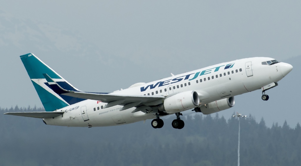 A Westjet aircraft is pictured taking off from Vancouver International Airport in Richmond, B.C., on May 13, 2019. THE CANADIAN PRESS/Jonathan Hayward 