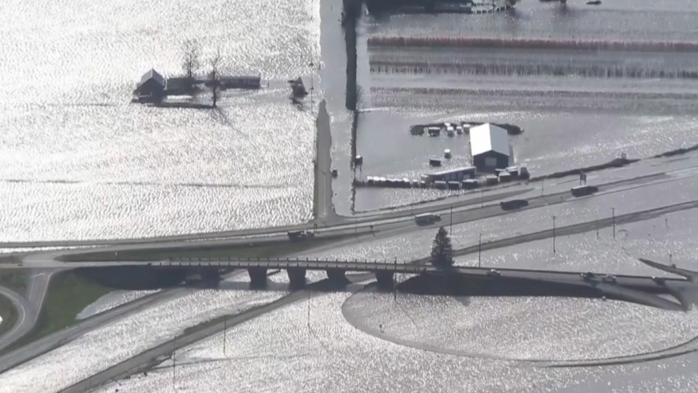 Aerial footage from Nov. 17 shows flood water covering farmland and parts of the Trans Canada Highway in Abbotsford, B.C.