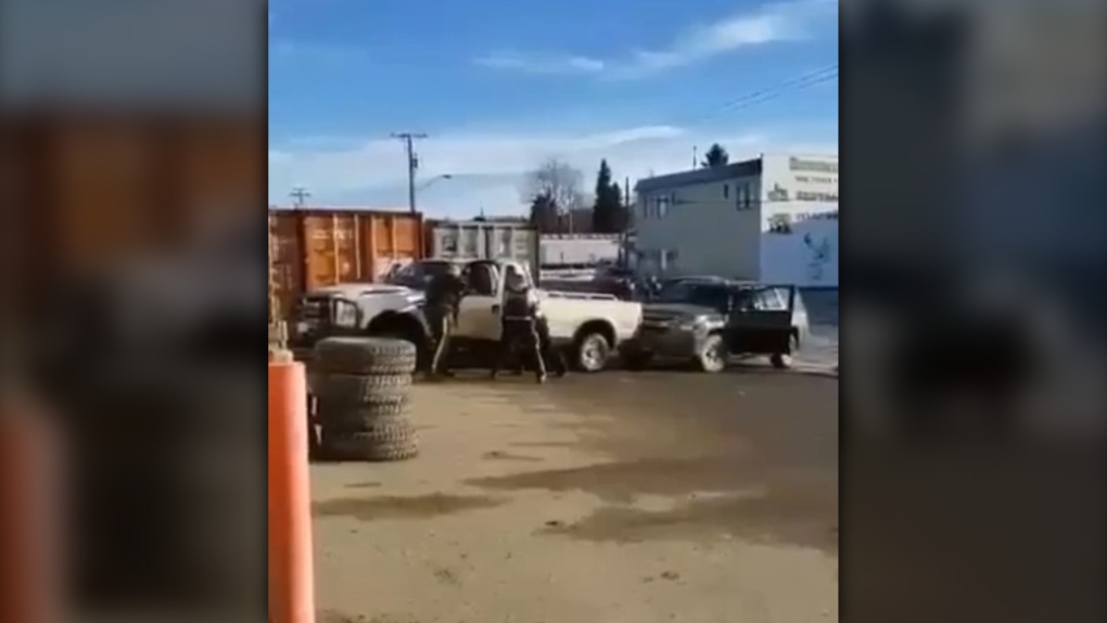 Police surround a white pickup truck in the northern B.C. community of Vanderhoof, in video posted to Facebook on Nov. 25, 2021. (Alison Johnny)