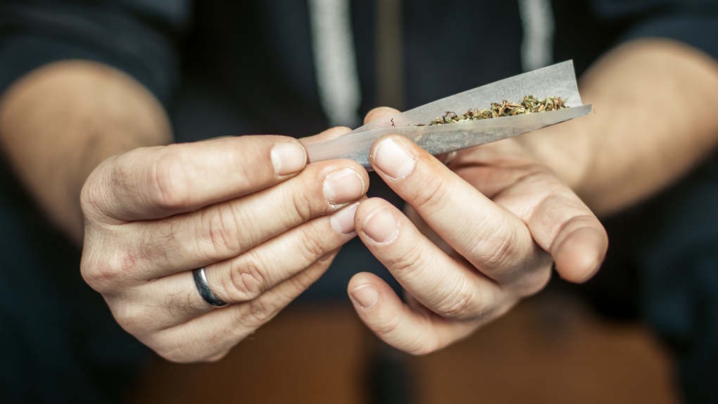 A man rolls a joint in an undated stock image from Shutterstock. 