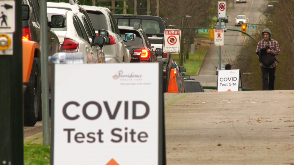 Vehicles are seen lined up for blocks outside a COVID-19 testing centre in Vancouver's South Cambie neighbourhood on Dec. 17, 2021. 