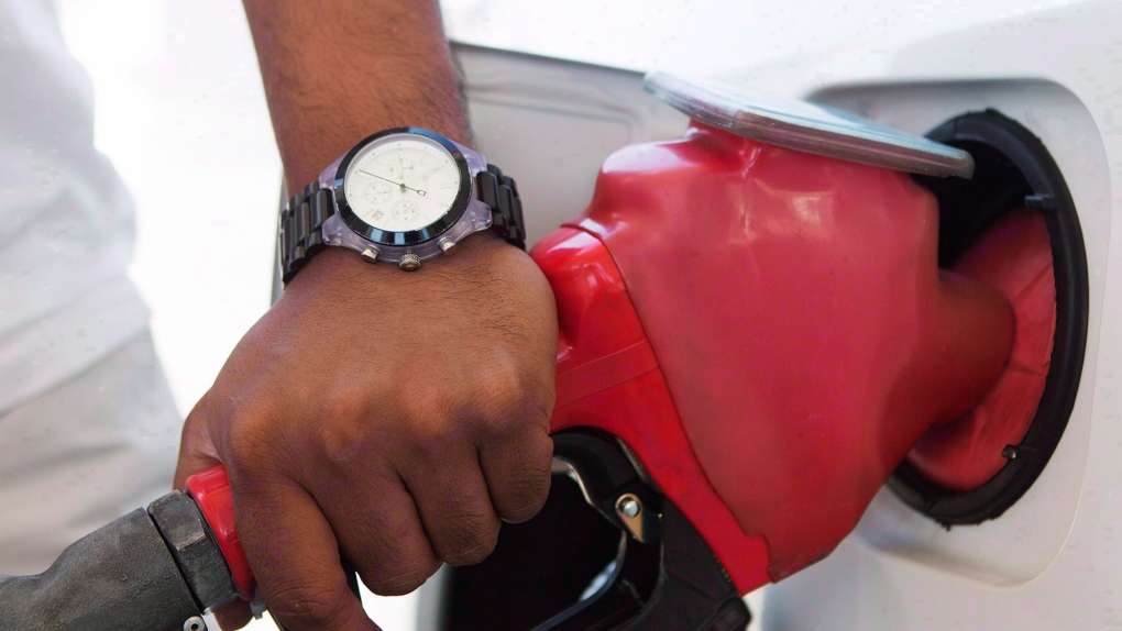 A person pumps fuel in Toronto. (THE CANADIAN PRESS/Michelle Siu)