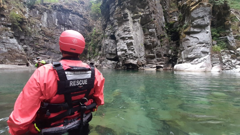 Members of Hope Search and Rescue's swiftwater team wade into the waters at the Othello Tunnels to mount a rescue operation. (Facebook/Hope Search and Rescue, Swiftwater TL: RC)