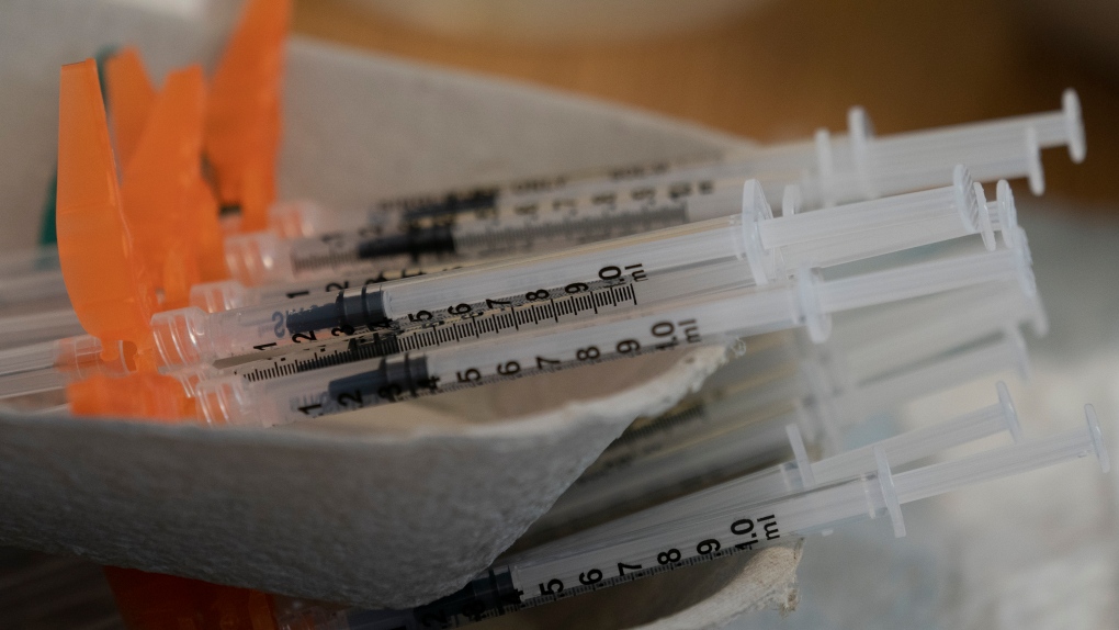 Needles are seen filled with the vaccination for COVID-19 at a truck stop along highway 91 North in Delta, B.C., Wednesday, June 16, 2021. THE CANADIAN PRESS/Jonathan Hayward 