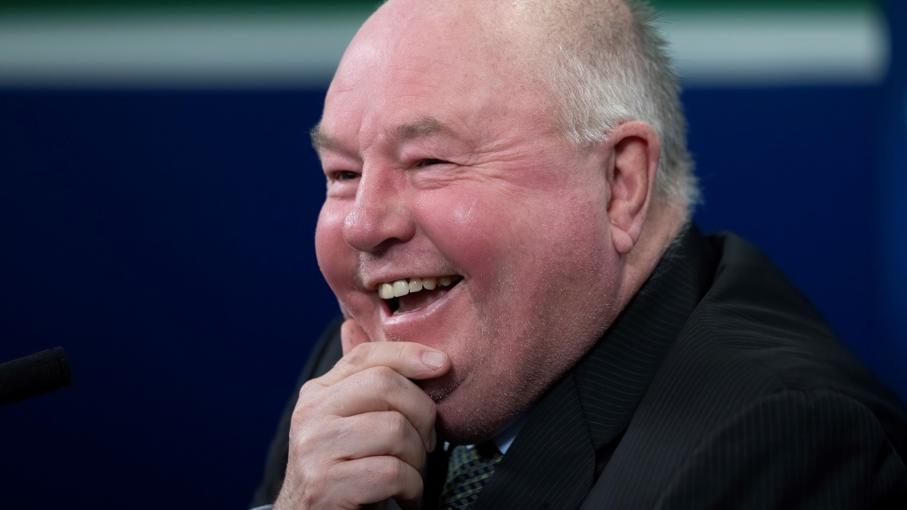 Vancouver Canucks new head coach Bruce Boudreau smiles as he attends a news conference in Vancouver, B.C., Monday, Dec. 6, 2021. (Jonathan Hayward / THE CANADIAN PRESS)