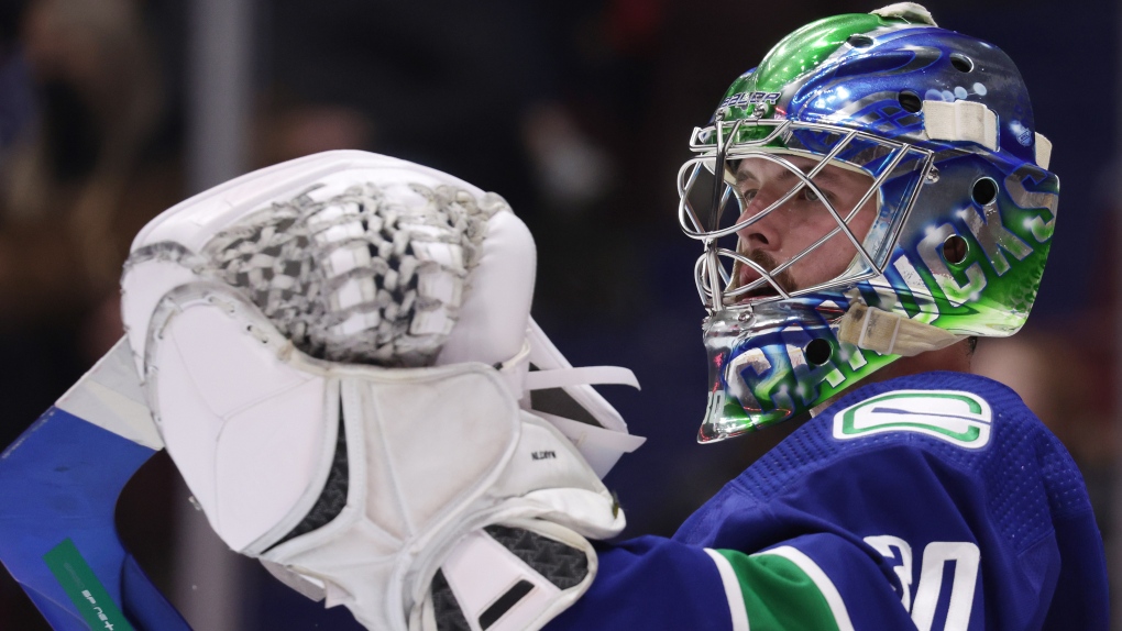 Vancouver Canucks goalie Spencer Martin looks on during a stoppage in play during the first period of an NHL hockey game against the Florida Panthers in Vancouver, on Friday, January 21, 2022. THE CANADIAN PRESS/Darryl Dyck 