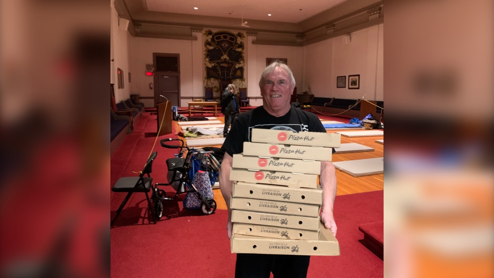 Pizzas arrive at the Vancouver Odd Fellows Lodge, which operates an annual warming centre in partnership with the city. (Vancouver Odd Fellows)
