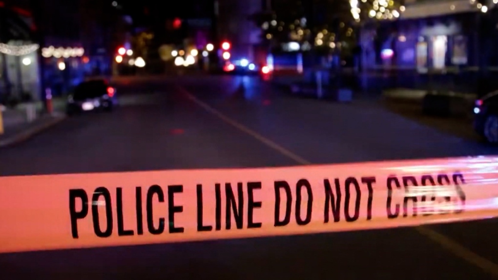 A stock image shows police tape surrounding a scene at night. 