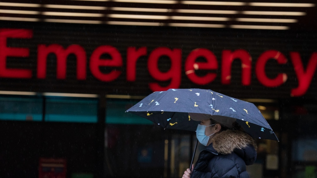 A person wears a protective face covering to help prevent the spread of COVID-19 while walking past the emergency entrance of Vancouver General Hospital in Vancouver, B.C., Friday, April 9, 2021. THE CANADIAN PRESS/Jonathan Hayward