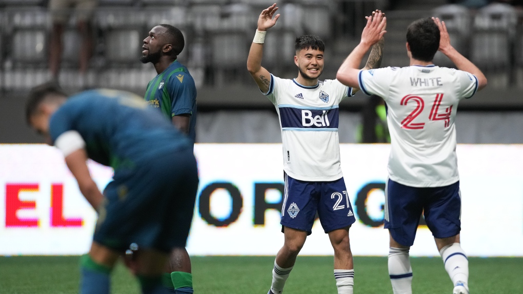 Vancouver Whitecaps' Ryan Raposo (27) and Brian White (24) celebrate White's first goal during the second half of a Canadian Championship semifinal soccer match, in Vancouver, on Wednesday, June 22, 2022. THE CANADIAN PRESS/Darryl Dyck