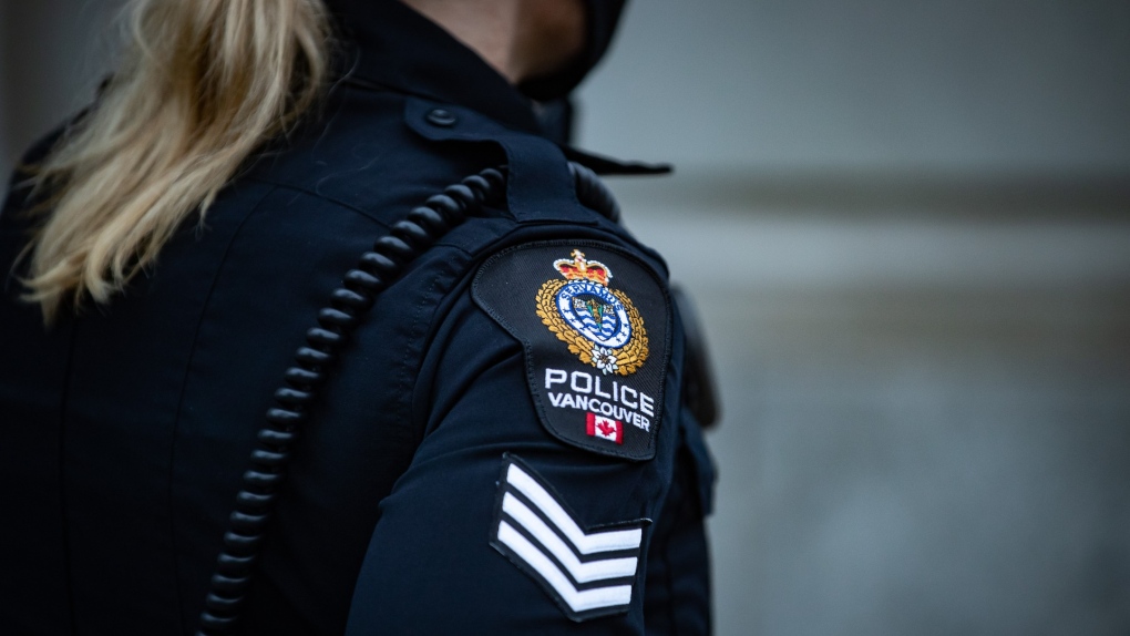 A Vancouver Police Department patch is seen on an officer's uniform as she makes a phone call after responding to an unknown incident in the Downtown Eastside of Vancouver, on Saturday, January 9, 2021. THE CANADIAN PRESS/Darryl Dyck 