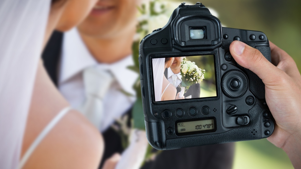A wedding photographer is seen in this stock image. (Shutterstock)