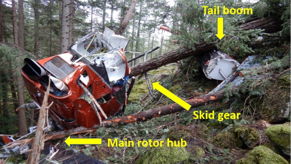 An image from the Transportation Safety Board shows a damaged helicopter following a crash on Bowen Island in March 2021. 