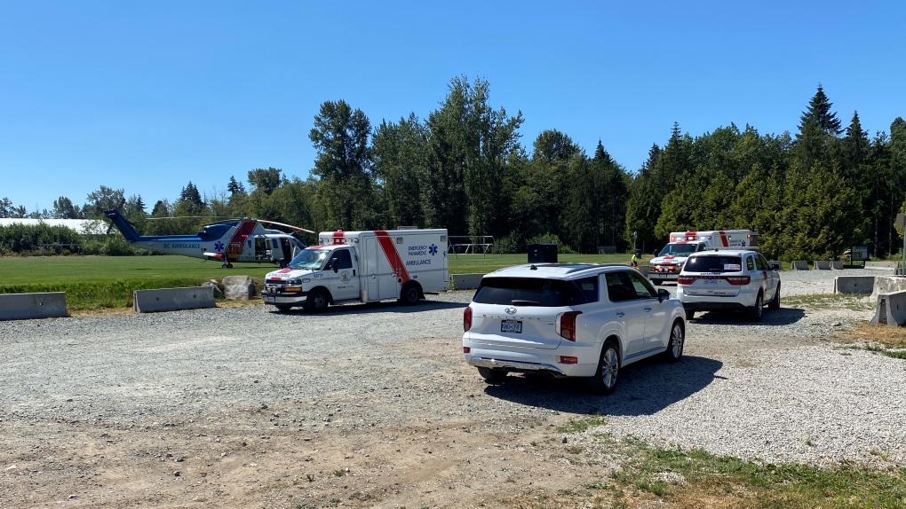 Several ambulances and an air ambulance helicopter are seen in Langley on Monday, Aug. 8, 2022. (Scott Connorton / CTV News Vancouver)