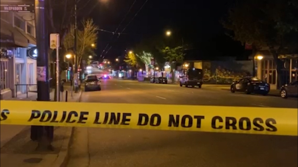 (FILE) Police tape is seen blocking part of Commercial Drive in East Vancouver. 