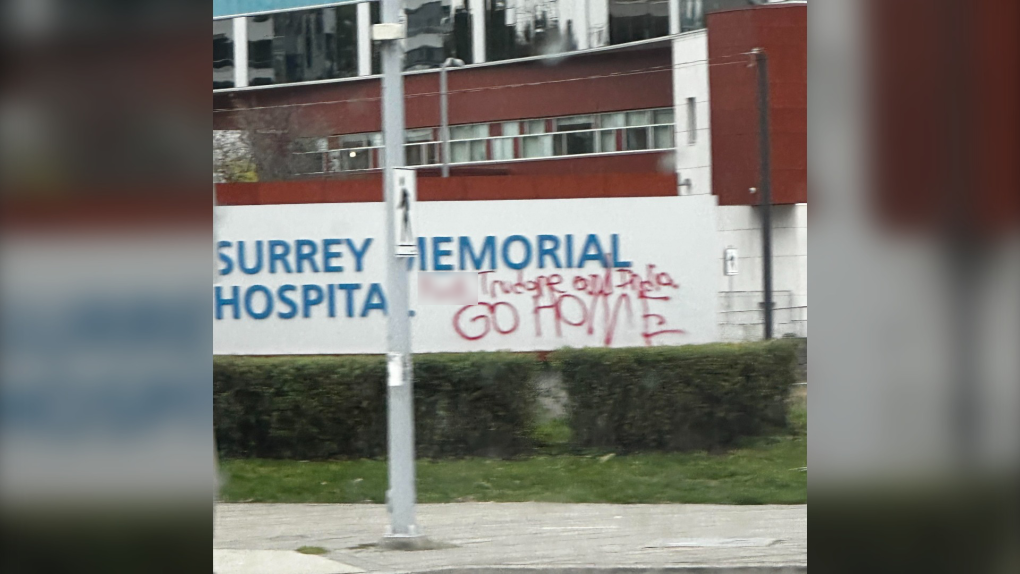 Graffiti is seen on a sign for Surrey Memorial Hospital in an image posted to Reddit. 