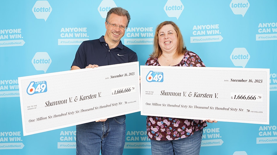 A photo provided by the B.C. Lottery Corporation shows a couple who bought two winning tickets for the same draw. 