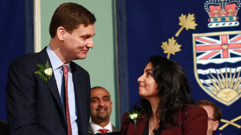 B.C. Attorney General Niki Sharma is congratulated by Premier David Eby after being sworn in during a ceremony at Government House in Victoria, B.C., on Wednesday, December 7, 2022. THE CANADIAN PRESS/Chad Hipolito