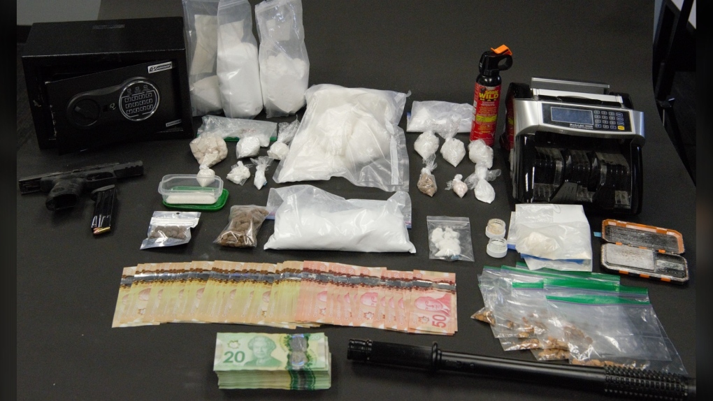 Police in New Westminster say they seized "several high-end vehicles" along with cash, suspected drugs and a loaded gun while executing two search warrants simultaneously earlier this month. (NWPD)