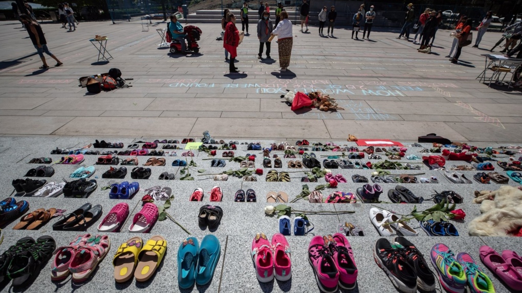 Two hundred and fifteen pairs of children's shoes are placed on the steps of the Vancouver Art Gallery n Vancouver on Friday, May 28, 2021, as a memorial to children who did not return from residential schools. THE CANADIAN PRESS/Darryl Dyck
