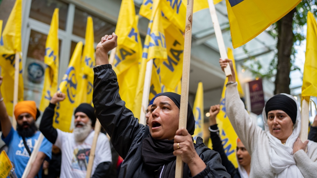 Protesters chant outside of the Consulate General of India Office during a protest for the recent shooting of Shaheed Bhai Hardeep Singh Nijjar in Vancouver, on Saturday, June 24, 2023. THE CANADIAN PRESS/Ethan Cairns