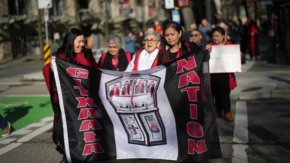 Members of the Gitxaala Nation, including Chief Councillor Linda Innes, front right, march to B.C. Supreme Court in Vancouver, B.C., Monday, April 3, 2023. THE CANADIAN PRESS/Darryl Dyck