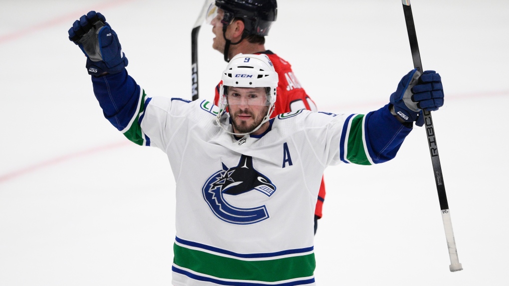 Vancouver Canucks center J.T. Miller (9) celebrates after his winning goal during overtime of an NHL hockey game against the Washington Capitals, Sunday, Feb. 11, 2024, in Washington. (AP Photo/Nick Wass)