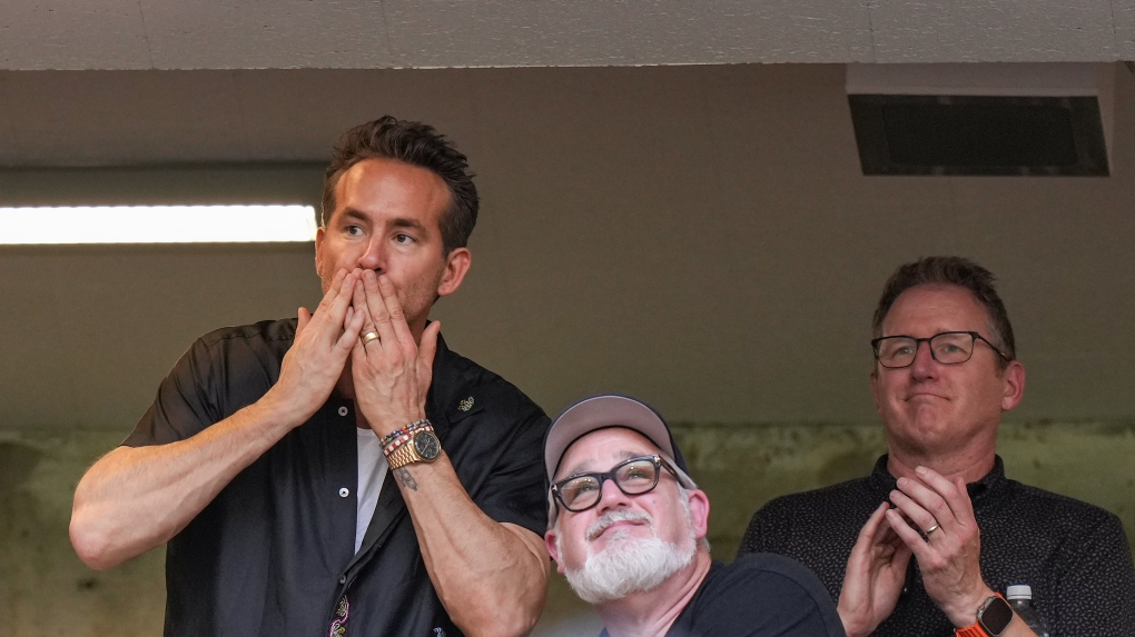 Wrexham co-owner, actor Ryan Reynolds, acknowledges the crowd while watching the team play an international friendly soccer match against the Vancouver Whitecaps, in Vancouver, on Saturday, July 27, 2024. THE CANADIAN PRESS/Darryl Dyck