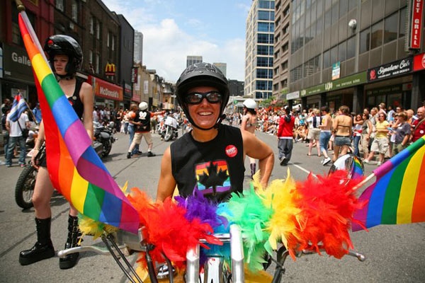 A woman shows off her pride on her bike during the Dyke March in Toronto on Saturday, June 28,2008. (Richard Wahab / CTV Toronto)